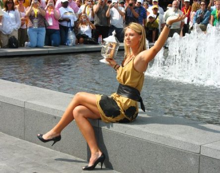 NEW YORK - SEPTEMBER 10 US Open 2006 champion Maria Sharapova holds US Open trophy in the front of the crowd after her win the ladies singles final on September 10, 2006 in New York